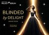 Plakat zur neuen Grand Show BLINDED by DELIGHT im Querformat: eine Frau in einem glamourösen, funkelnden Abendkleid